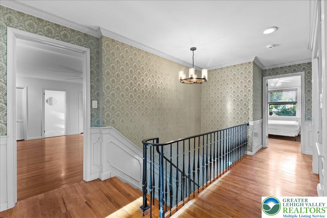 1331 Armstrong Road Bethlehem, PA 18017 - Photo 19 of 28 a view of a hallway view with floor to ceiling window and wooden floor