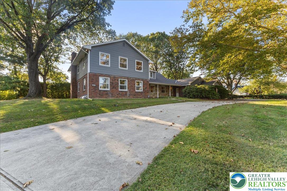 1331 Armstrong Road Bethlehem, PA 18017 - Photo 2 of 28 a front view of a house with a yard