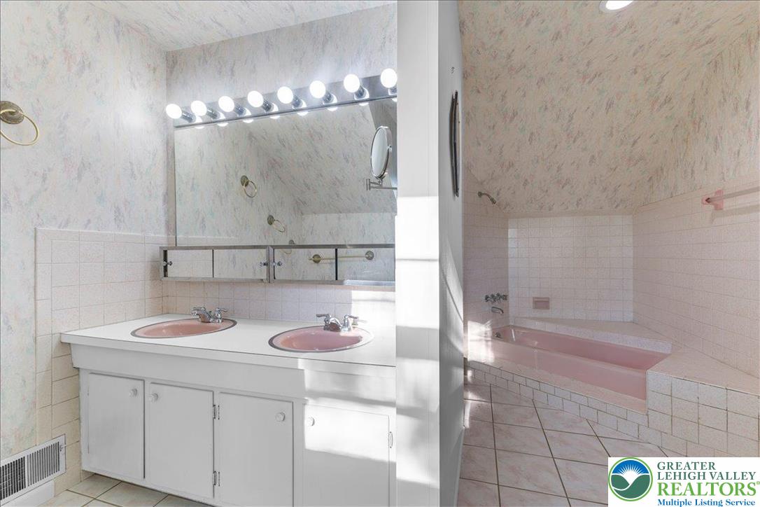 1331 Armstrong Road Bethlehem, PA 18017 - Photo 21 of 28 a bathroom with a sink a vanity and a mirror