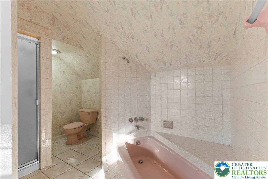 1331 Armstrong Road Bethlehem, PA 18017 - Photo 22 of 28 a bathroom with a granite countertop toilet a sink and bathtub