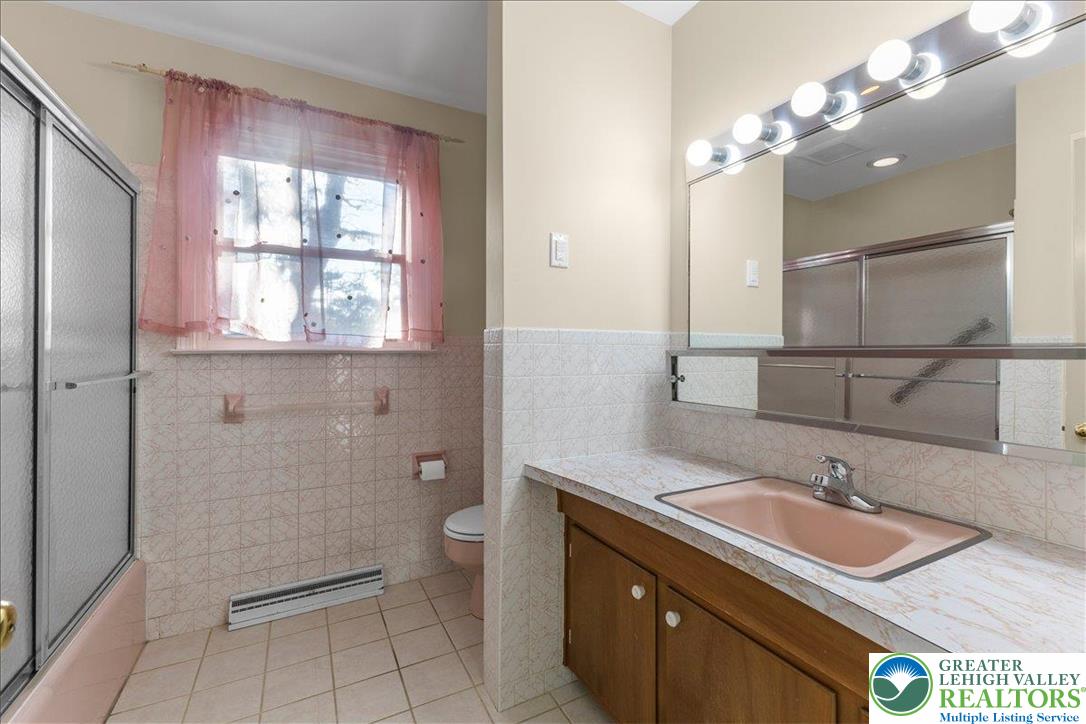 1331 Armstrong Road Bethlehem, PA 18017 - Photo 23 of 28 a bathroom with a sink a toilet and a mirror