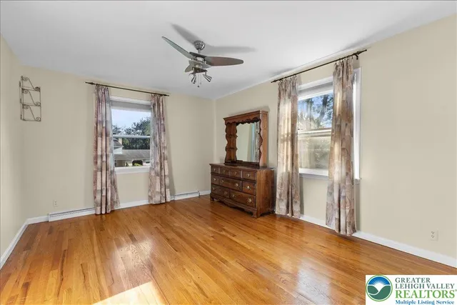 a view of a livingroom with wooden floor