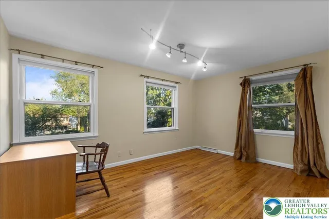 a view of a livingroom with furniture window and wooden floor