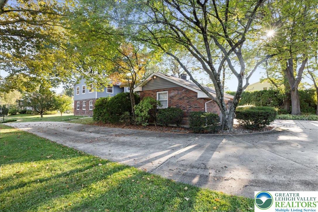 1331 Armstrong Road Bethlehem, PA 18017 - Photo 3 of 28 a front view of a house with a yard and potted plants