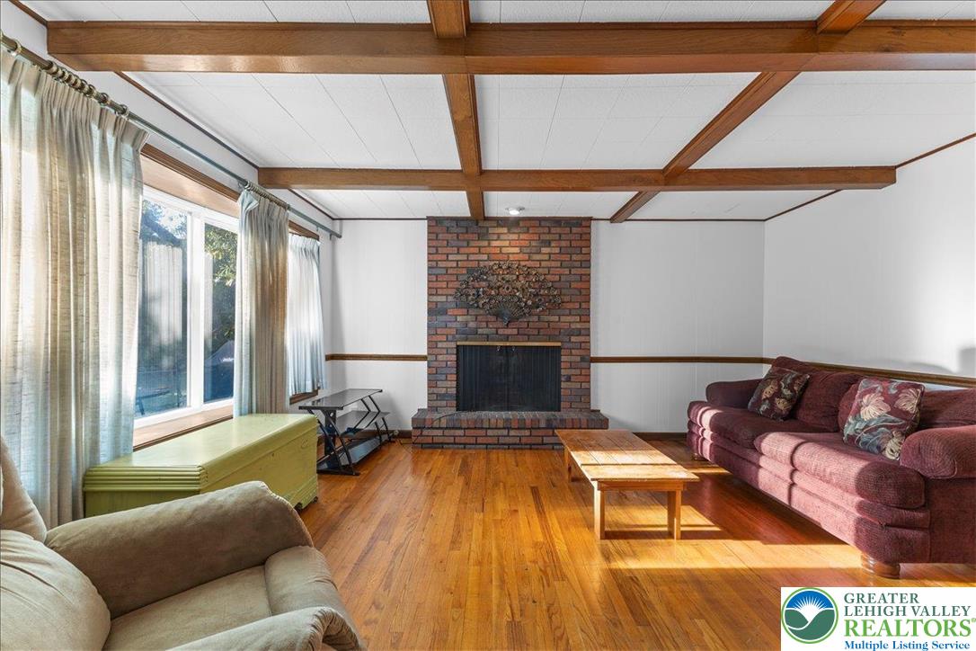 1331 Armstrong Road Bethlehem, PA 18017 - Photo 8 of 28 a living room with furniture and a fireplace