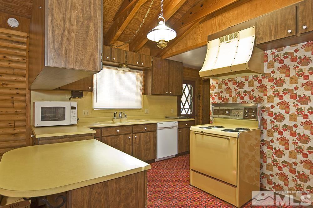 406 Pleasant Valley Road Markleeville, CA 96120 - Photo 14 of 25 a kitchen with stainless steel appliances granite countertop a sink stove and refrigerator