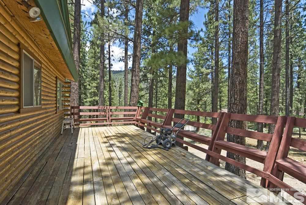 406 Pleasant Valley Road Markleeville, CA 96120 - Photo 6 of 25 a view of a patio with table and chairs and wooden floor