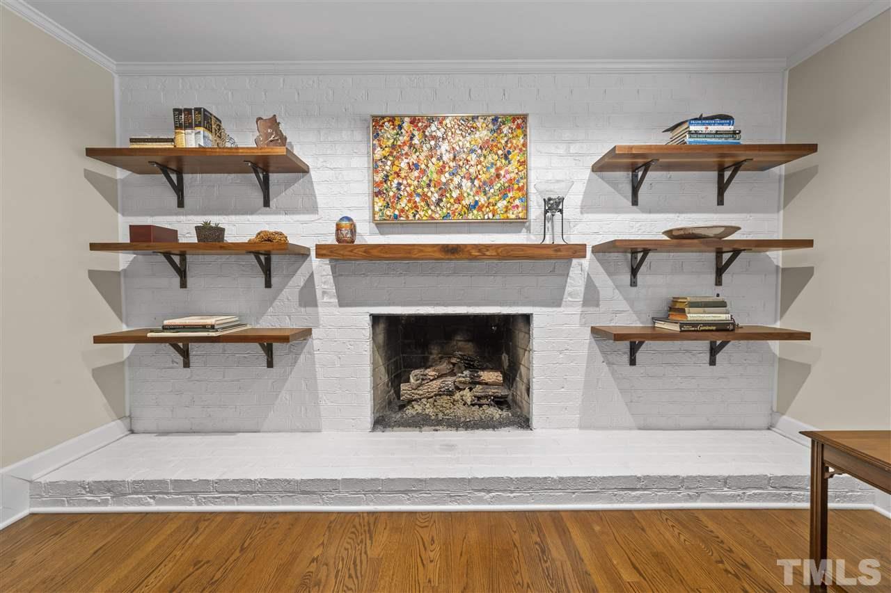 7808 Harps Mill Road Raleigh, NC 27615 - Photo 14 of 30 Beautiful fireplace with custom shelving