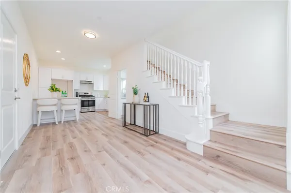 a view of kitchen with furniture and wooden floor
