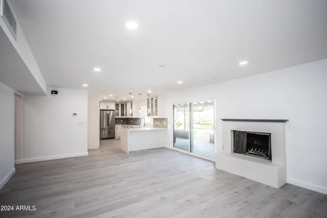 a view of a kitchen with a sink and a stove top oven