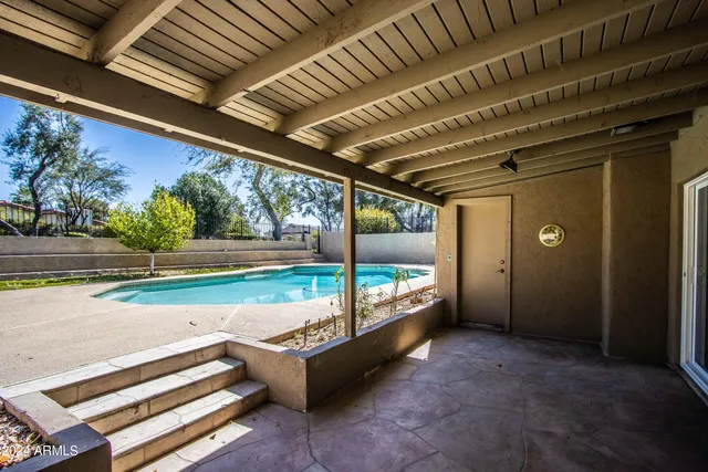 a view of a porch and garden