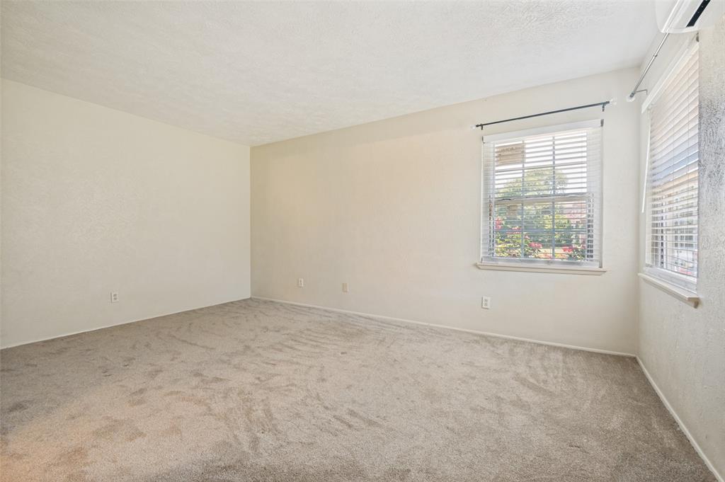 7305 Pineberry Road Dallas, TX 75249 - Photo 15 of 25 an empty room with windows