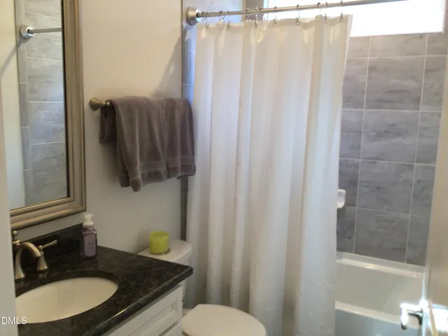 a room with lots of wooden furniture and a floor to ceiling window