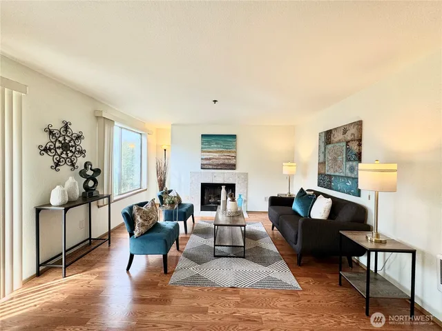 a living room with furniture fireplace and lamp