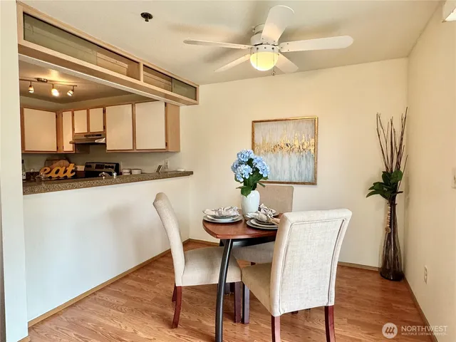 a dining room with furniture and window