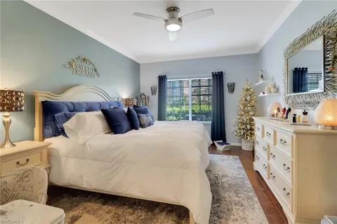 a bed room with bed and a window