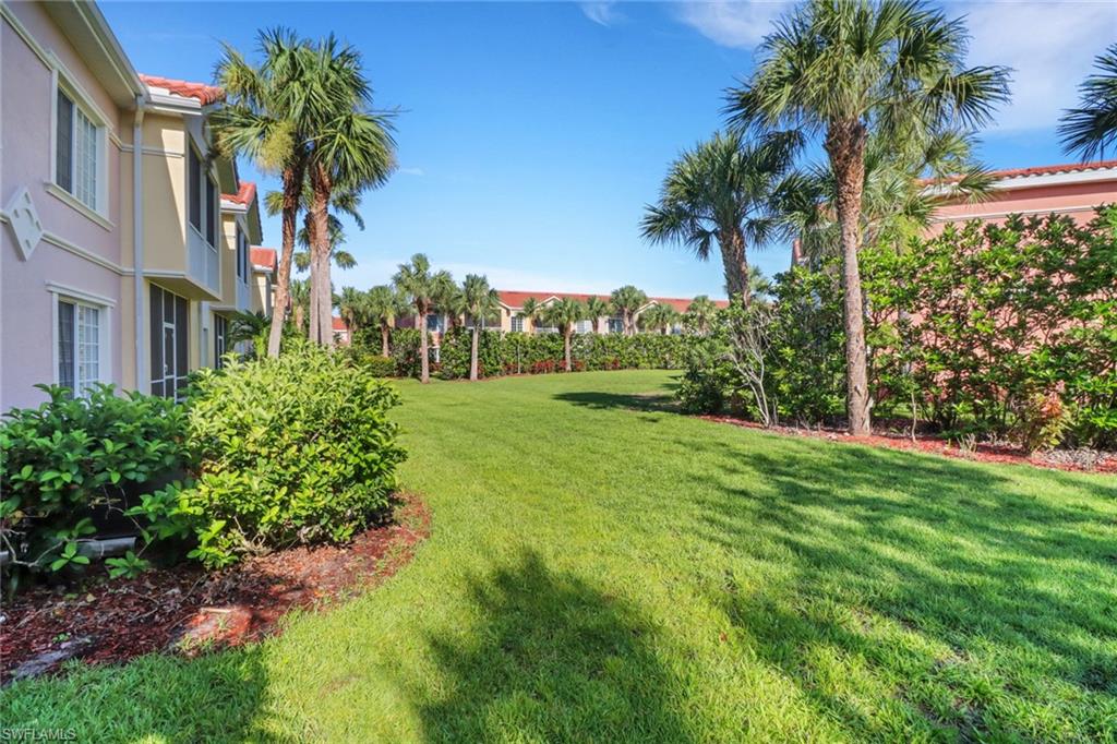 10126 Villagio Palms Way, Unit 107 Estero, FL 33928 - Photo 26 of 43 a view of a yard in front of a house