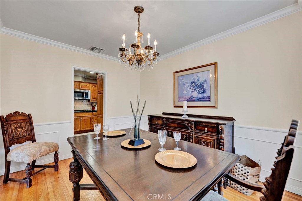 5456 Cadbury Road Whittier, CA 90601 - Photo 21 of 67 a view of a dining room with furniture and a chandelier