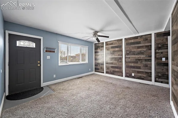 a view of an empty room with a window