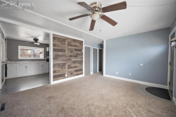 a view of an empty room with a window