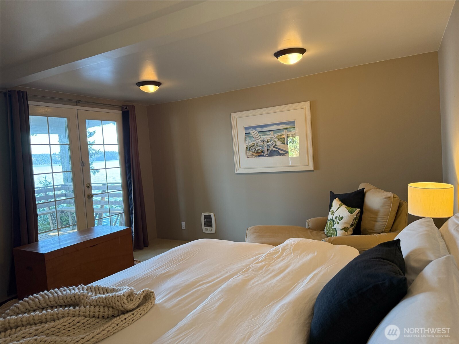 71 Seal Rock Road Brinnon, WA 98320 - Photo 11 of 22 a bedroom with a bed and wooden floor