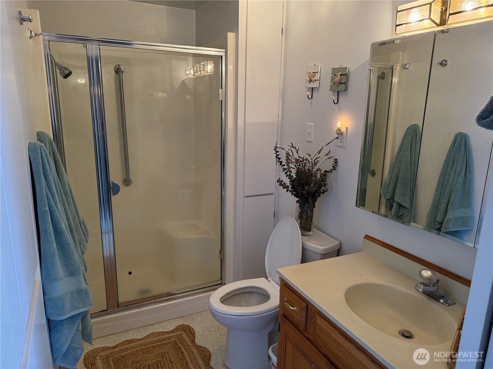 71 Seal Rock Road Brinnon, WA 98320 - Photo 13 of 22 a bathroom with a sink toilet and shower