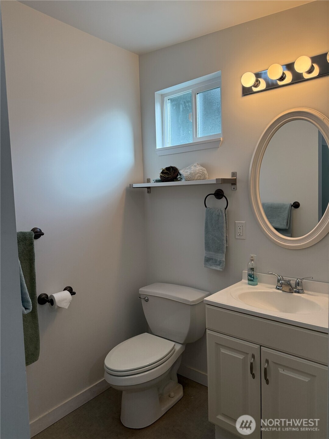 71 Seal Rock Road Brinnon, WA 98320 - Photo 16 of 22 a bathroom with a toilet sink and mirror