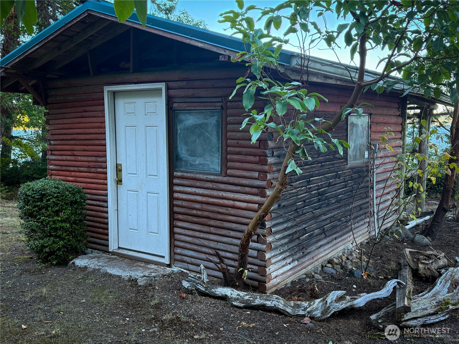 71 Seal Rock Road Brinnon, WA 98320 - Photo 22 of 22 a front view of a house with a yard