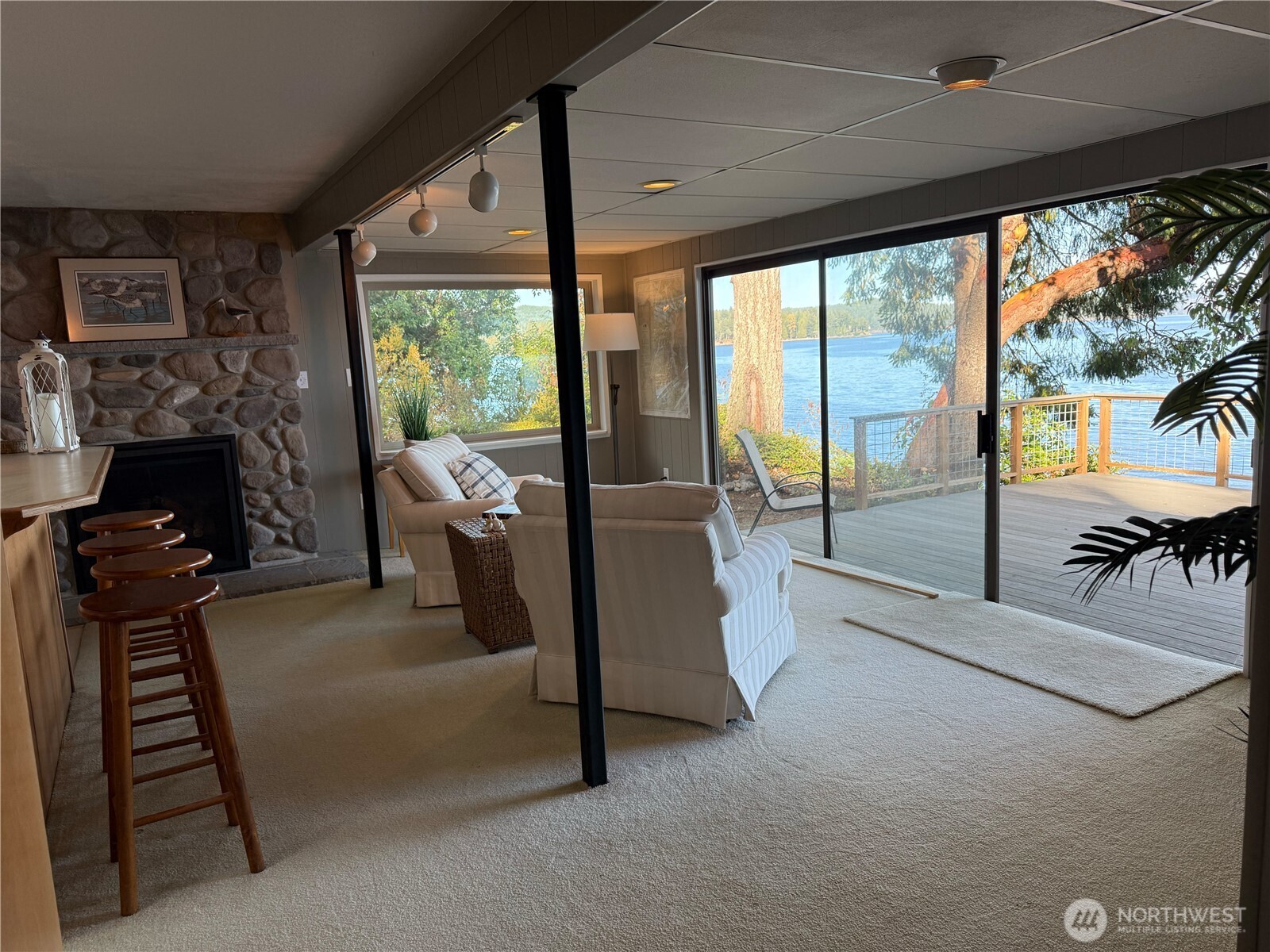 71 Seal Rock Road Brinnon, WA 98320 - Photo 5 of 22 a living room with furniture and a fireplace