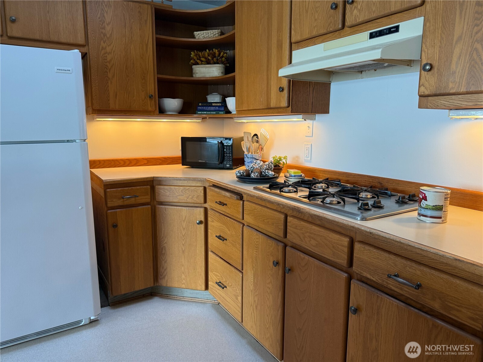 71 Seal Rock Road Brinnon, WA 98320 - Photo 7 of 22 a kitchen with stainless steel appliances a stove and a refrigerator