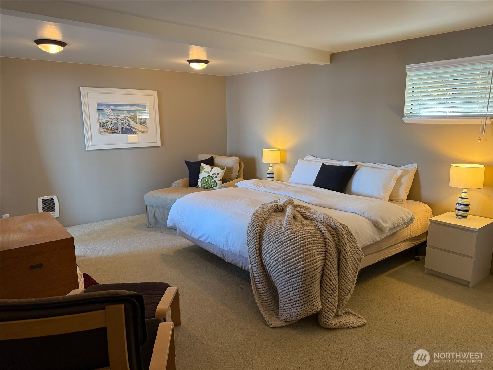 71 Seal Rock Road Brinnon, WA 98320 - Photo 10 of 22 a bedroom with a bed and a lamp on dresser