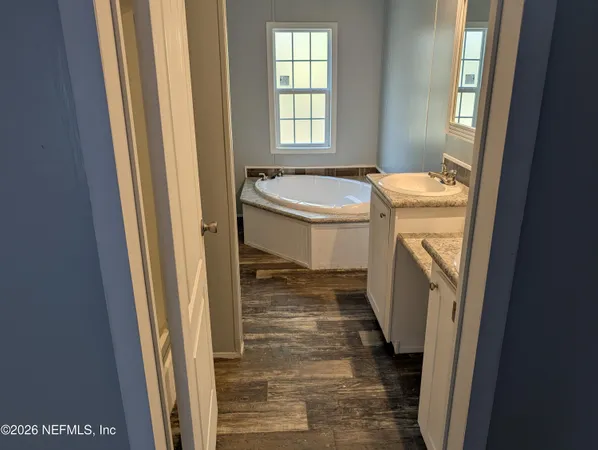 a bathroom with sink and mirror