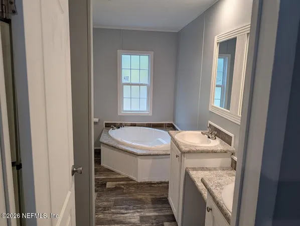 a bathroom with a sink a toilet and a bathtub