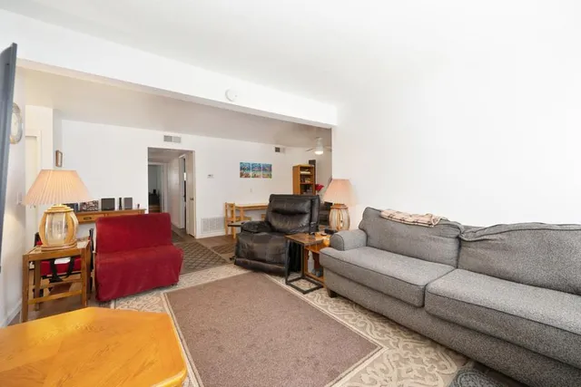 a living room with furniture and a couch