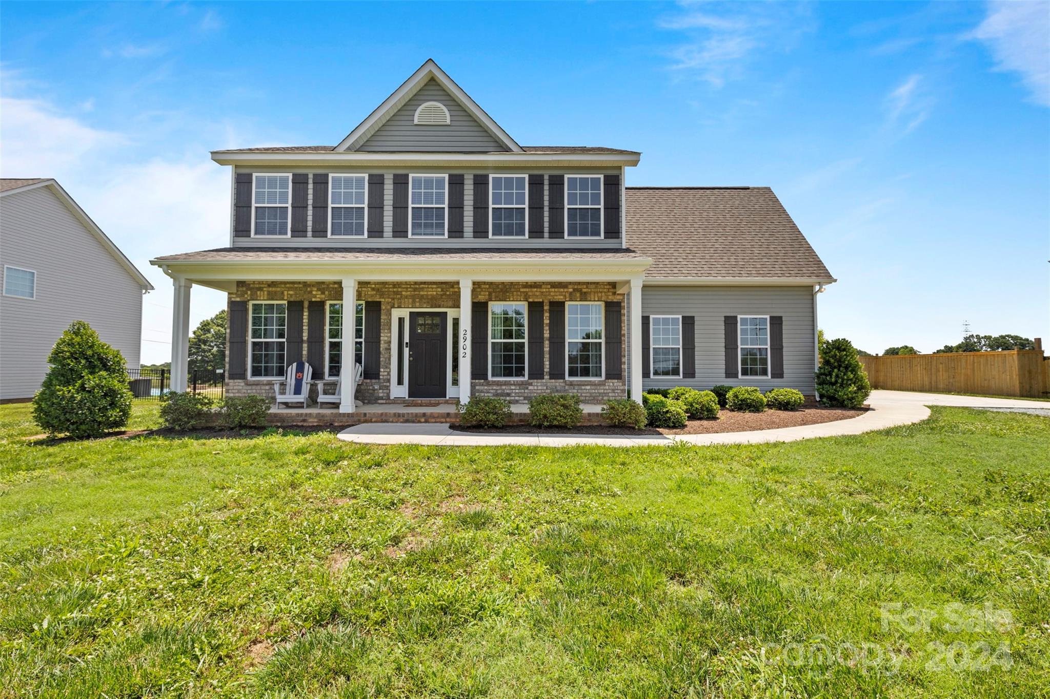 2902 New Salem Road Monroe, NC 28110 - Photo 1 of 28 a front view of a house with yard patio and swimming pool