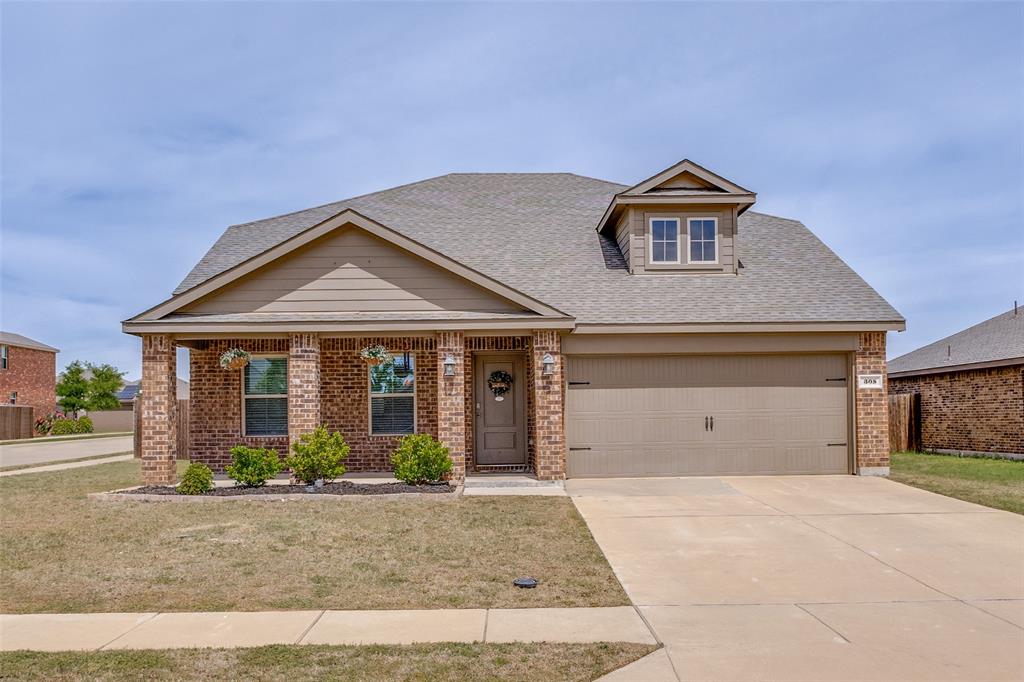 305 Ginger Avenue Anna, TX 75409 - Photo 2 of 28 a front view of a house with garden