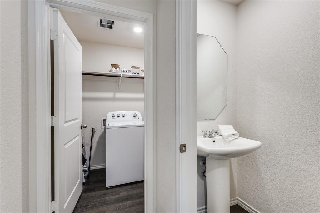 305 Ginger Avenue Anna, TX 75409 - Photo 24 of 28 a bathroom with a sink and mirror