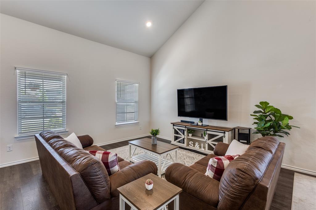305 Ginger Avenue Anna, TX 75409 - Photo 5 of 28 a living room with furniture and a flat screen tv