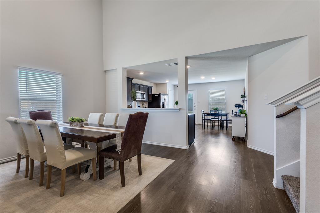 305 Ginger Avenue Anna, TX 75409 - Photo 7 of 28 a view of a dining room with furniture and wooden floor