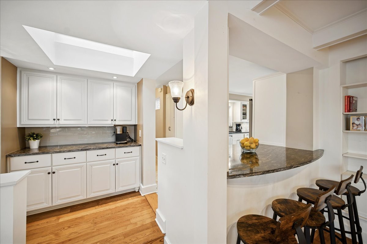 2085 Stirling Road Bannockburn, IL 60015 - Photo 12 of 48 a kitchen with white cabinets and sink