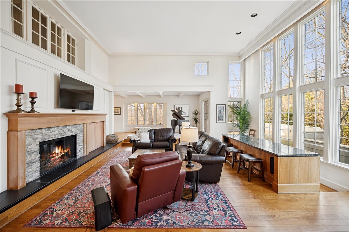 2085 Stirling Road Bannockburn, IL 60015 - Photo 15 of 48 a living room with furniture fireplace and a flat screen tv
