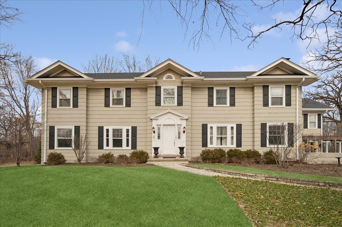2085 Stirling Road Bannockburn, IL 60015 - Photo 2 of 48 a front view of a house with a garden