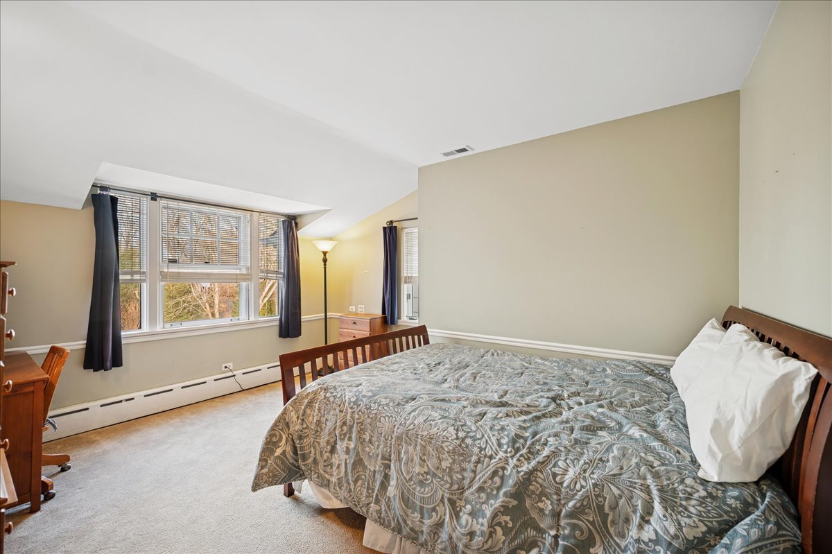 2085 Stirling Road Bannockburn, IL 60015 - Photo 25 of 48 a bedroom with a bed and a window