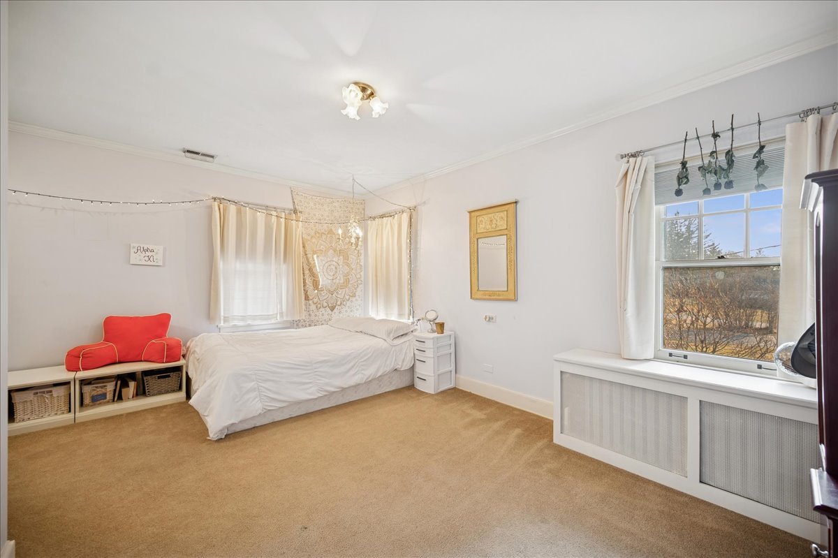 2085 Stirling Road Bannockburn, IL 60015 - Photo 30 of 48 a bedroom with a bed and a window