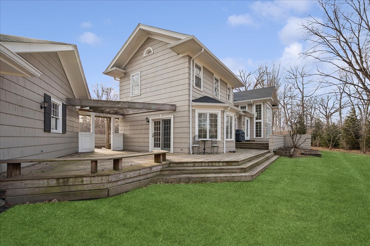 2085 Stirling Road Bannockburn, IL 60015 - Photo 40 of 48 a front view of house with a garden and patio