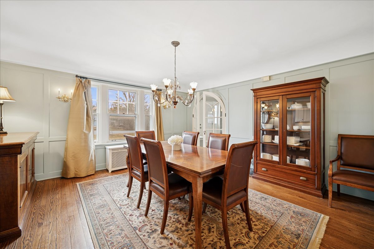2085 Stirling Road Bannockburn, IL 60015 - Photo 6 of 48 a view of a dining room with furniture window and wooden floor