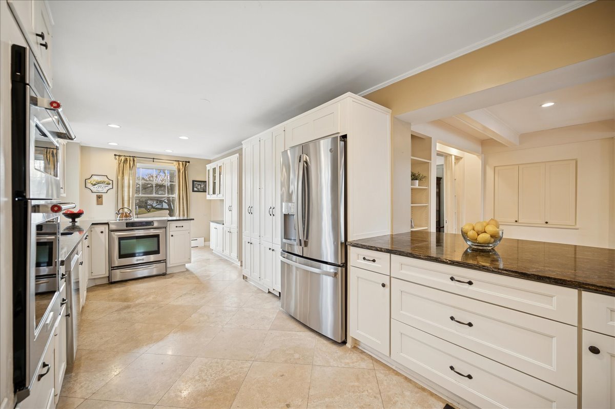 2085 Stirling Road Bannockburn, IL 60015 - Photo 7 of 48 a kitchen with stainless steel appliances a refrigerator and a stove top oven