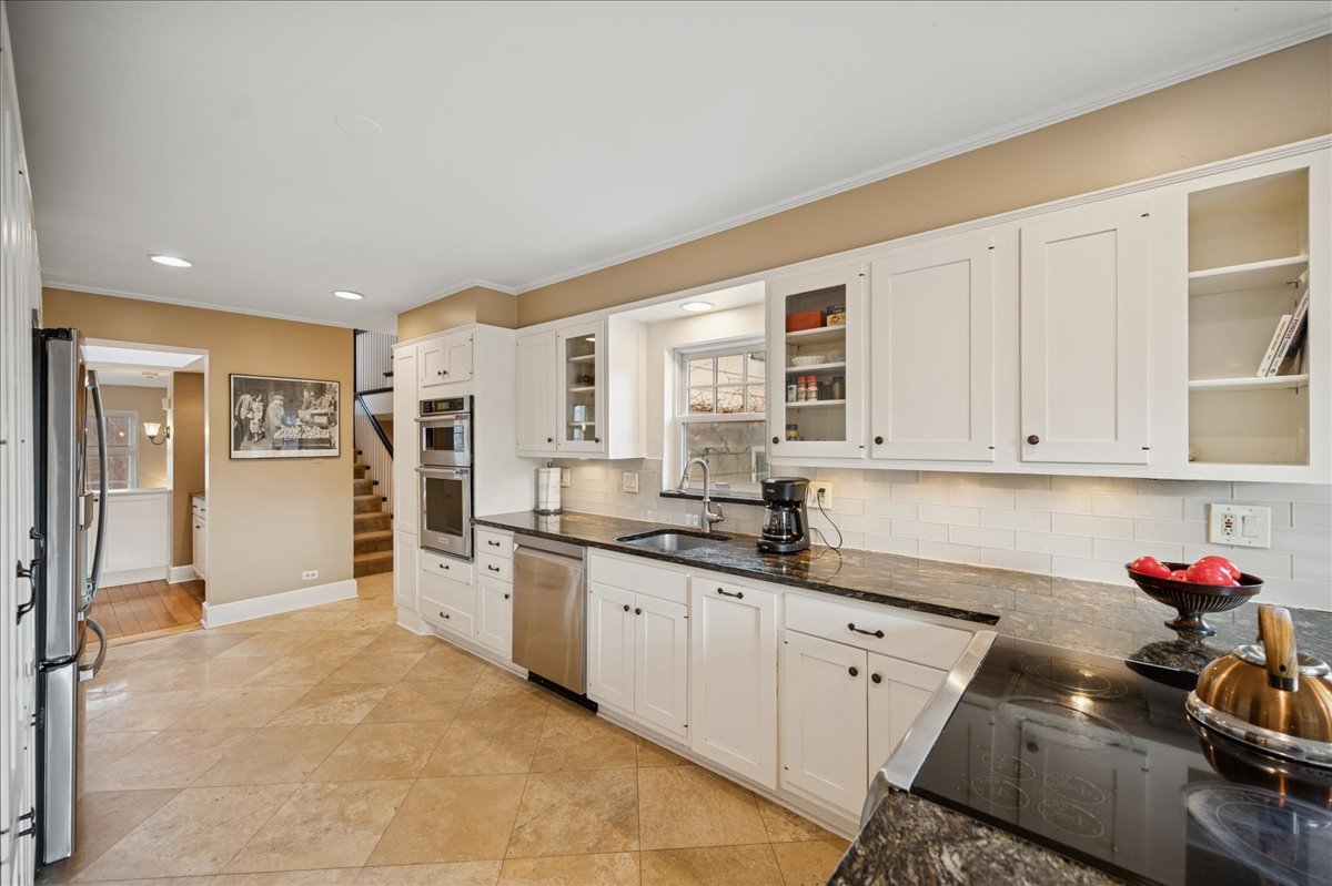 2085 Stirling Road Bannockburn, IL 60015 - Photo 9 of 48 a kitchen with granite countertop a sink cabinets and stainless steel appliances