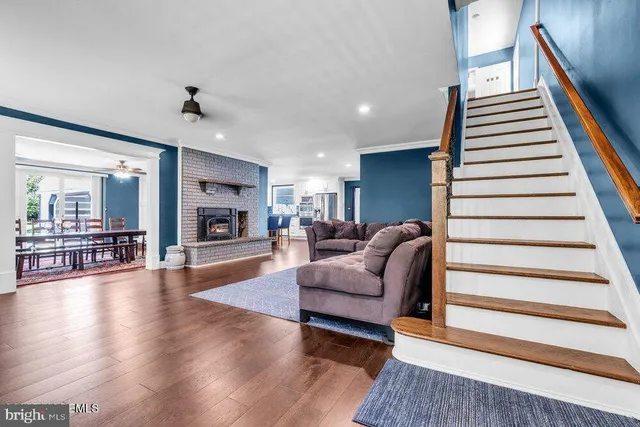 a dining room with furniture a rug and a chandelier