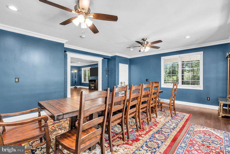 225 West Bird Village Road Jackson, NJ 08527 - Photo 16 of 66 a dining room with furniture a rug and a chandelier